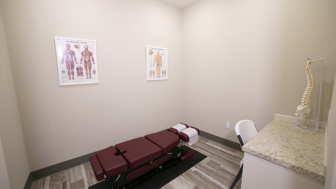 red leather padded massage bed inside building
