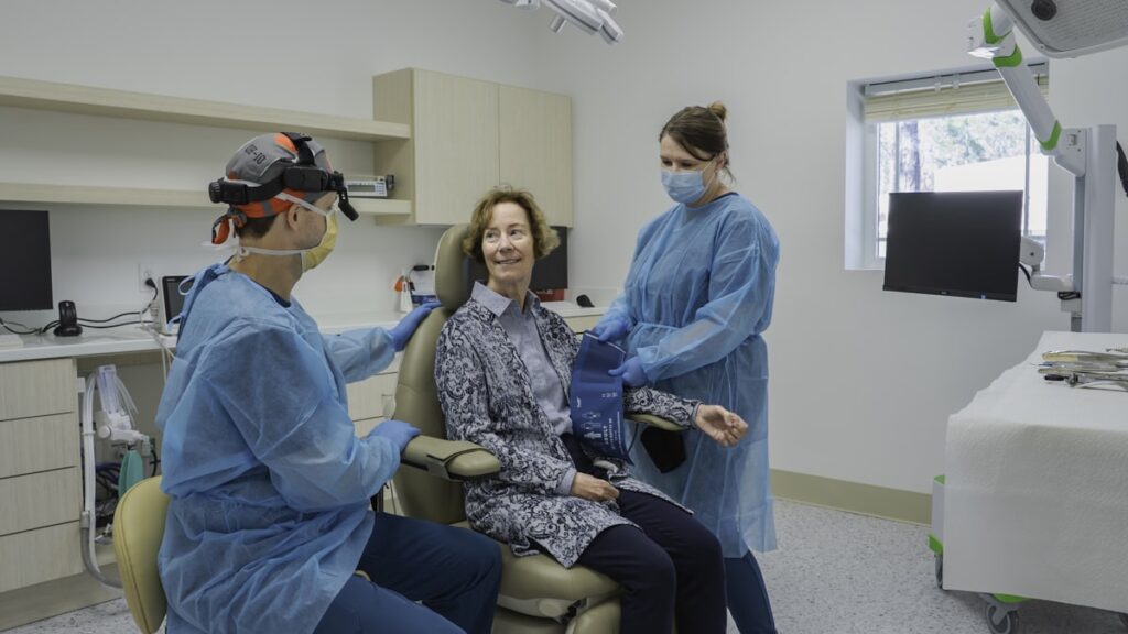 A group of people in a dental room