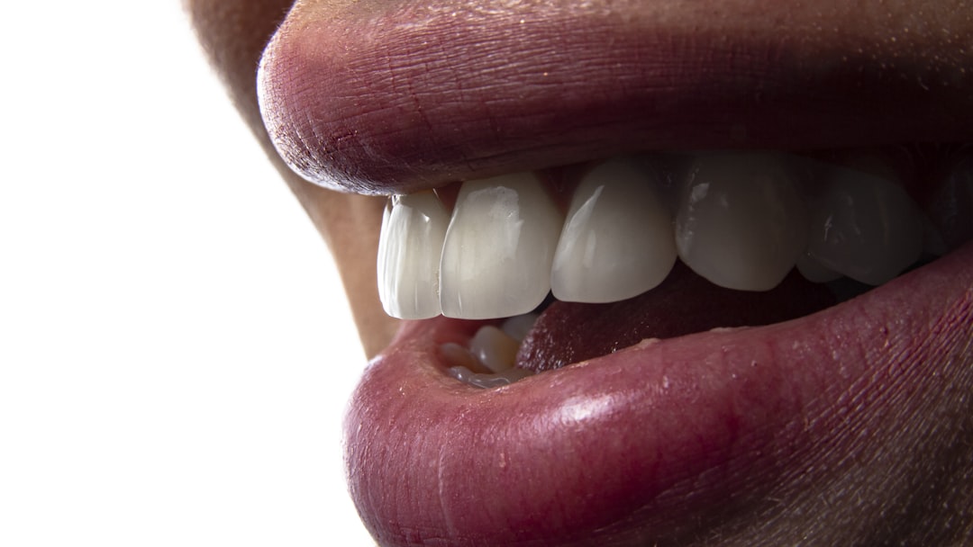 a close-up of a person's mouth with teeth showing