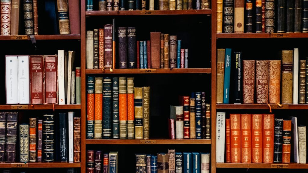 assorted-title of books piled in the shelves