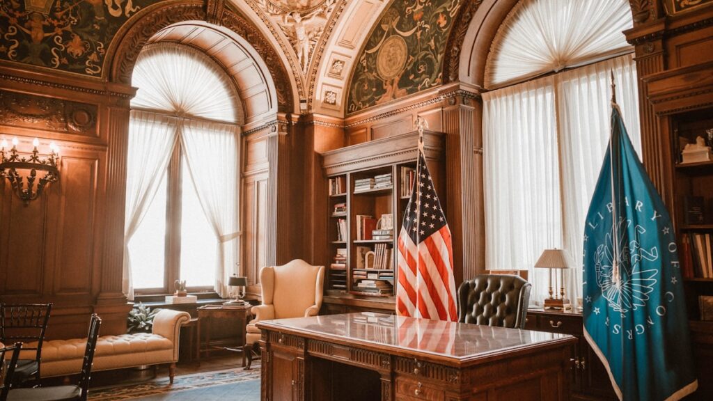 Elegant office with american flag and presidential desk.