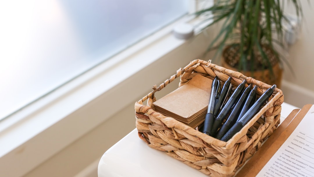 black and white pen in brown woven basket