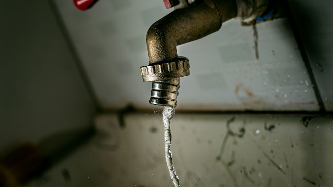 a water hose attached to a metal pipe