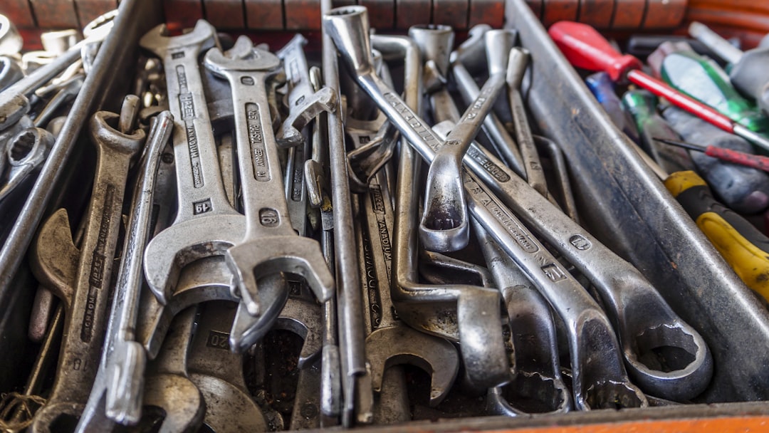 a box filled with lots of wrenches and other tools