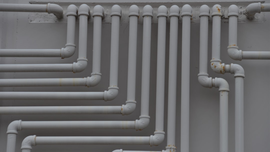 a close up of a bunch of pipes on a wall