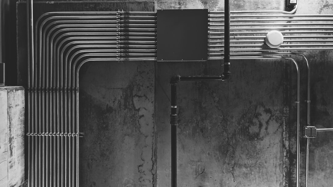 grayscale photo of water fountain