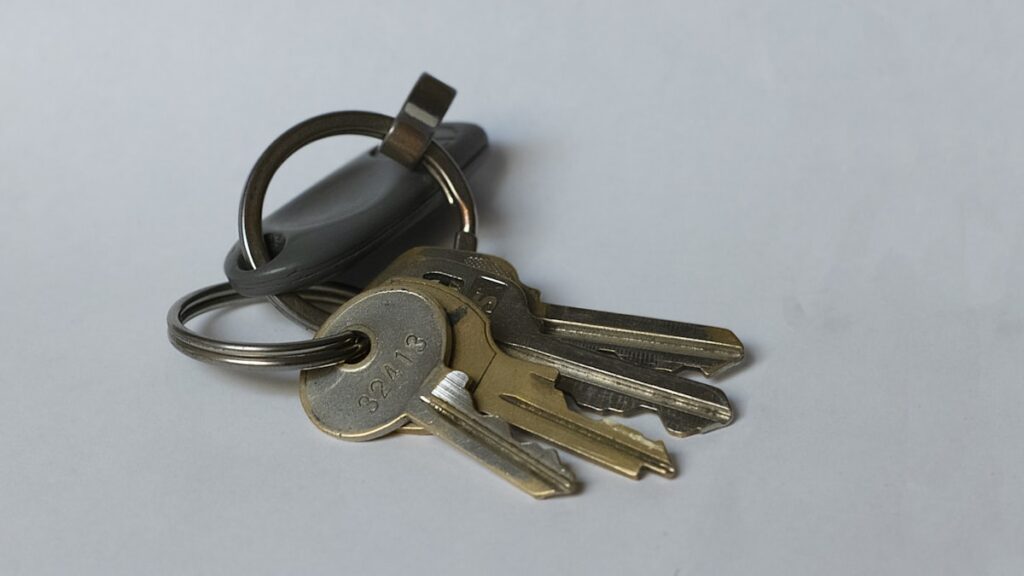 silver keys on white table