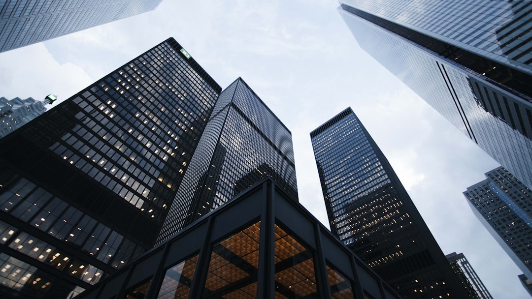 low angle photo of city high rise buildings during daytime