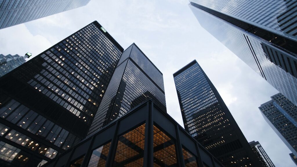 low angle photo of city high rise buildings during daytime