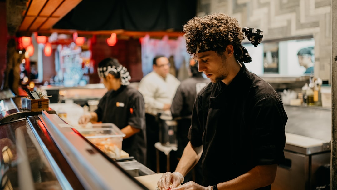 a group of people in a kitchen