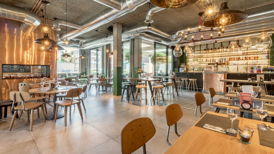 brown wooden tables and chairs inside building
