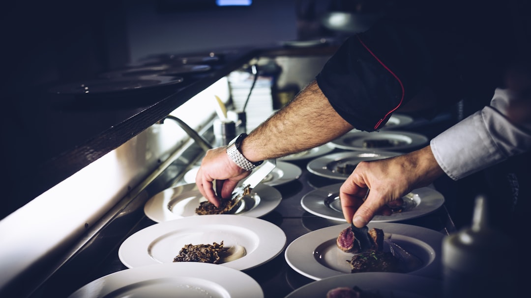person preparing cooked dish