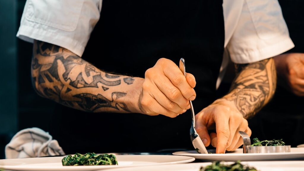 person putting food on plate