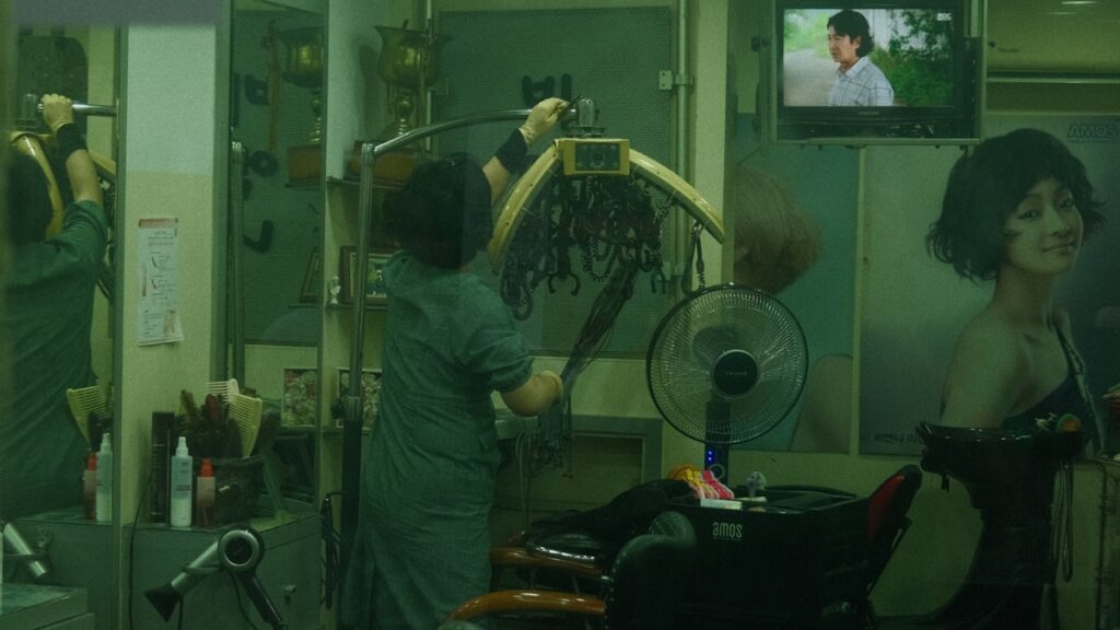 a woman in a hair salon getting her hair done