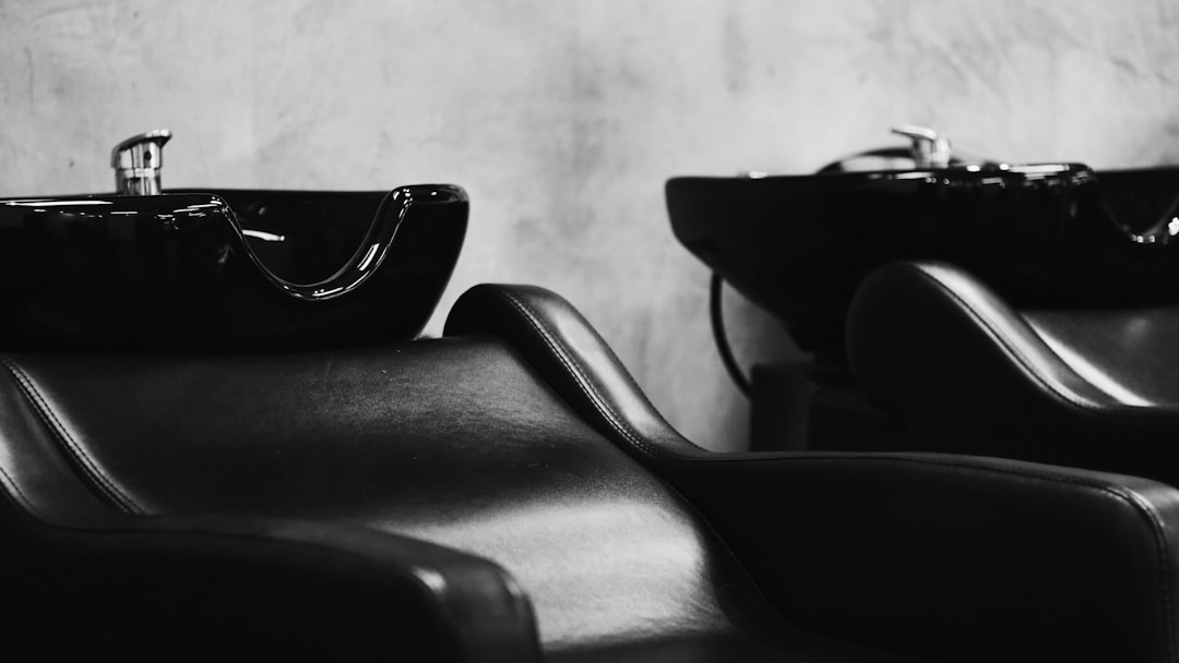 black sunglasses on black leather chair
