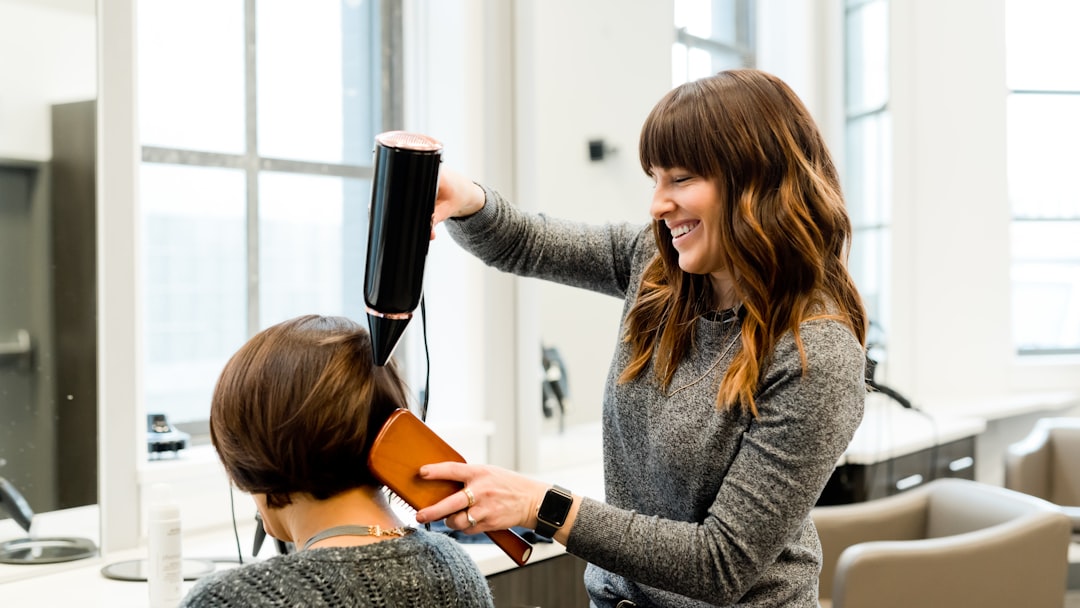 woman holding hair dryer
