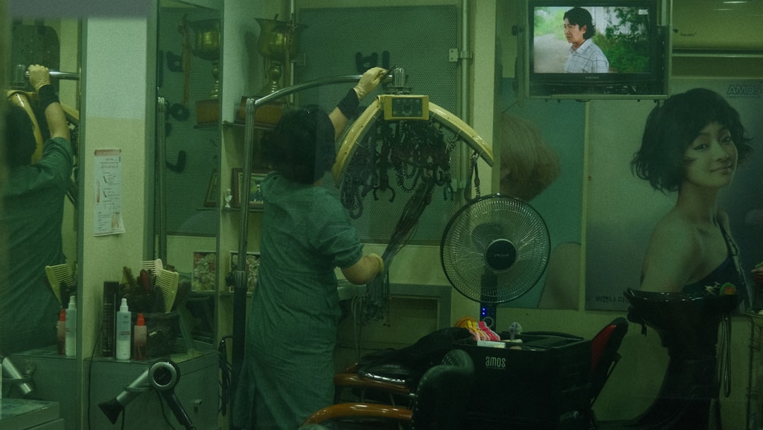a woman in a hair salon getting her hair done