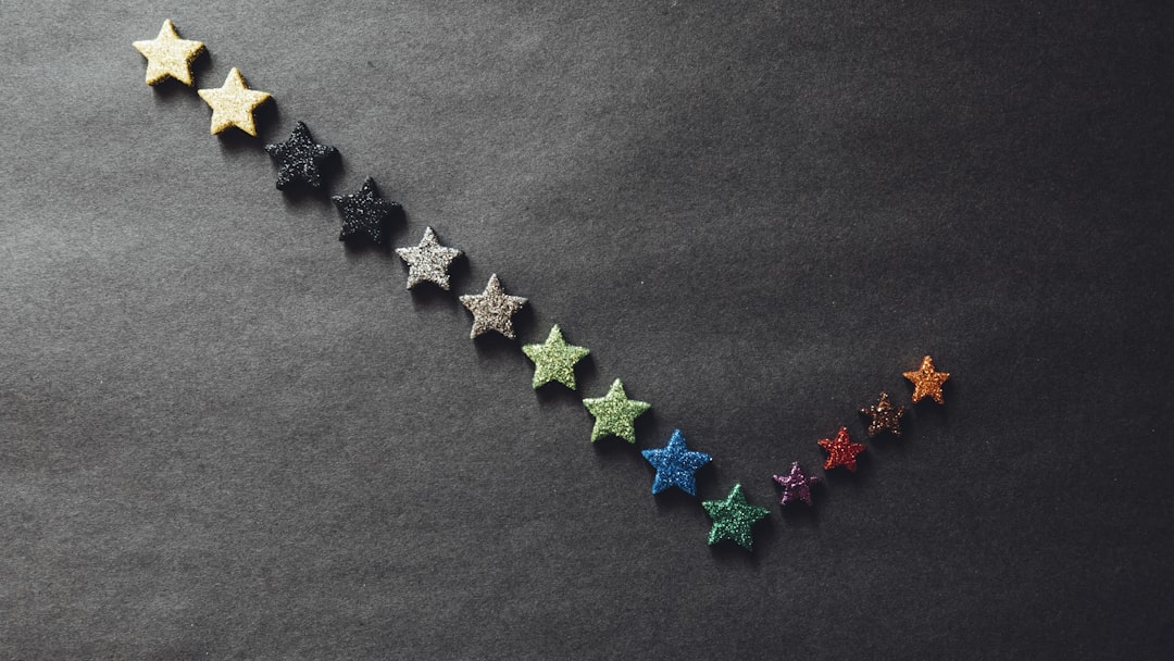 a row of stars on a black surface