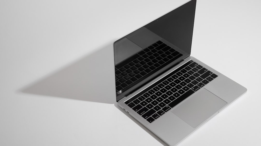 macbook pro on white table