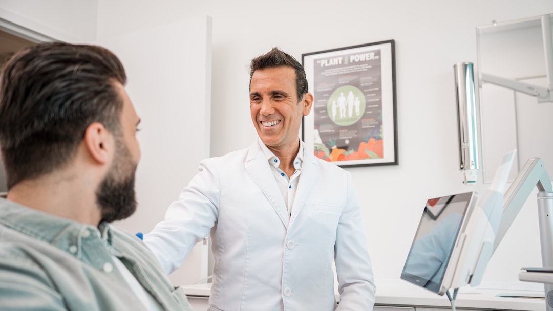 a man smiling at another man
